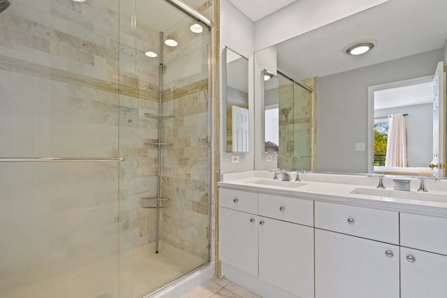 bathroom featuring vanity, tile patterned floors, and an enclosed shower