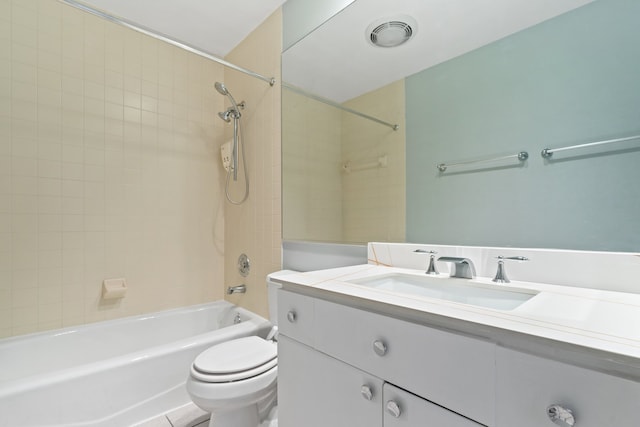 full bathroom with toilet, tiled shower / bath combo, and vanity