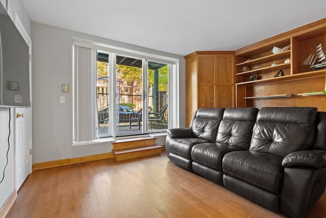 living room with light hardwood / wood-style floors