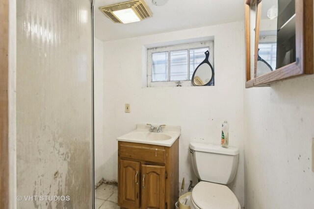 10238 S Vernon Ave, Chicago, IL 60628 - half bath featuring toilet, vanity, and tile patterned flooring