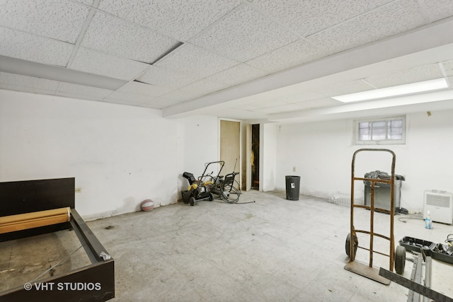 basement featuring a paneled ceiling