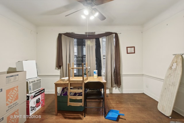 dining room featuring ceiling fan and dark wood-type flooring