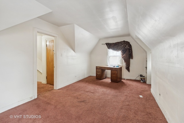 bonus room featuring light colored carpet and lofted ceiling