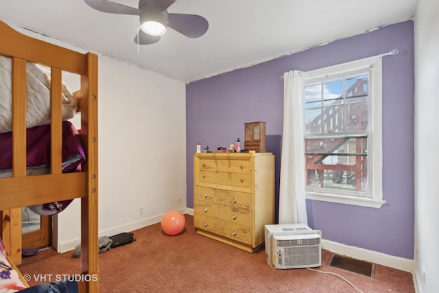 interior space featuring ceiling fan and carpet