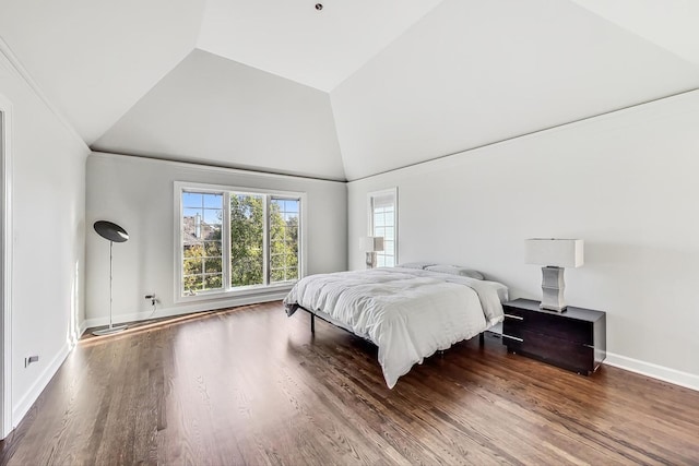 bedroom with wood-type flooring and high vaulted ceiling