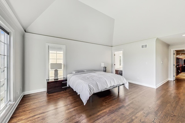 bedroom featuring vaulted ceiling and dark wood-type flooring