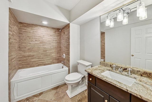 full bathroom with vanity, toilet, and tiled shower / bath