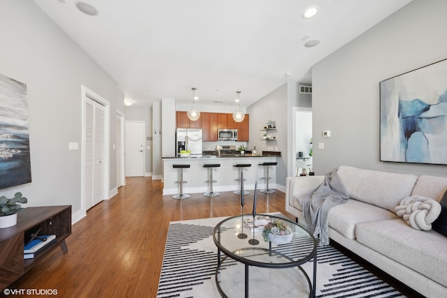 living room featuring dark hardwood / wood-style flooring