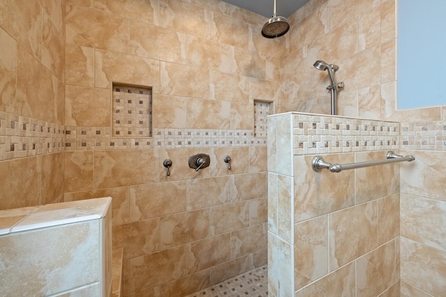 bathroom with tiled shower