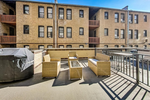 balcony featuring area for grilling and an outdoor hangout area