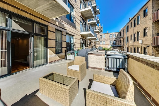 balcony featuring an outdoor living space and a grill