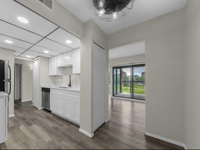 kitchen featuring light hardwood / wood-style flooring, white cabinets, and sink