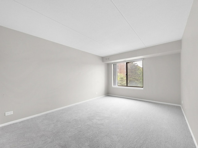 empty room featuring carpet flooring