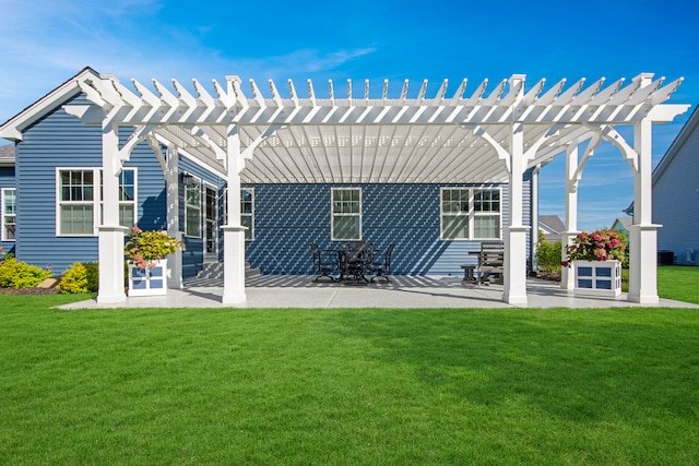 back of property with a lawn, a pergola, and a patio