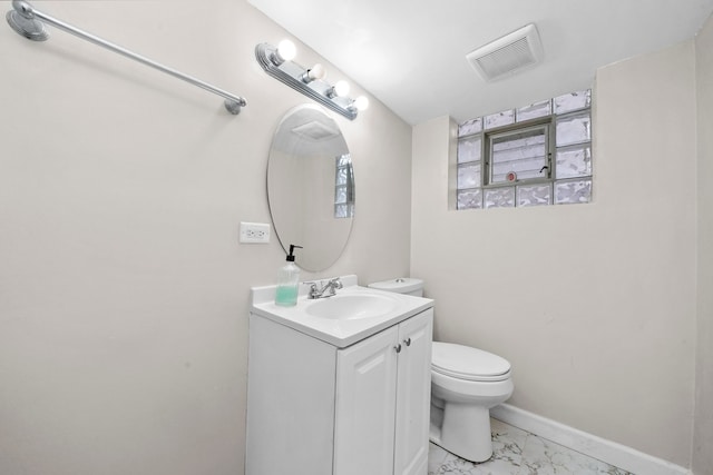 bathroom with vanity and toilet