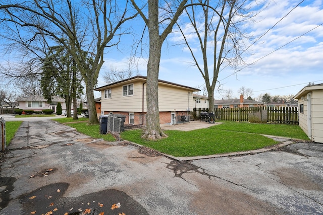 back of house with a yard