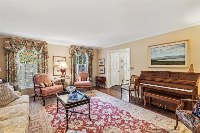 living room with hardwood / wood-style flooring, a healthy amount of sunlight, and ornamental molding