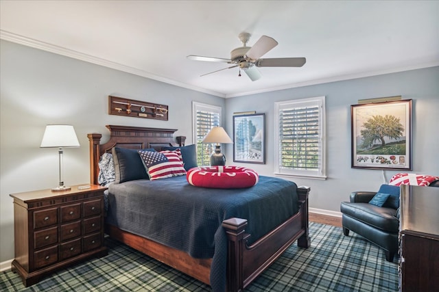 bedroom with ornamental molding, hardwood / wood-style flooring, and ceiling fan