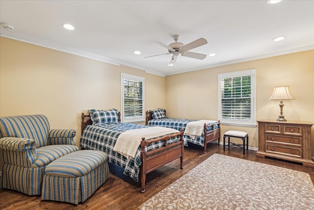 bedroom featuring dark wood-type flooring, ceiling fan, crown molding, and multiple windows