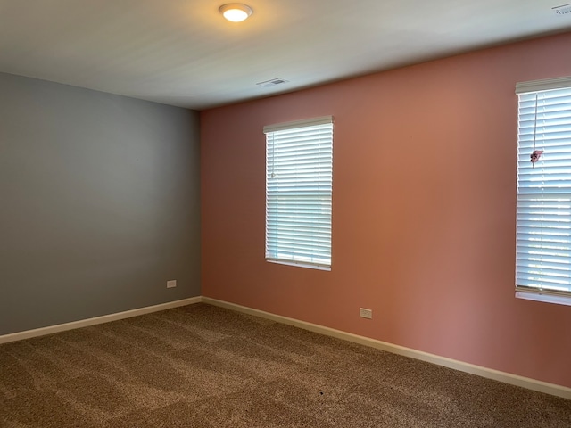 empty room with carpet and plenty of natural light