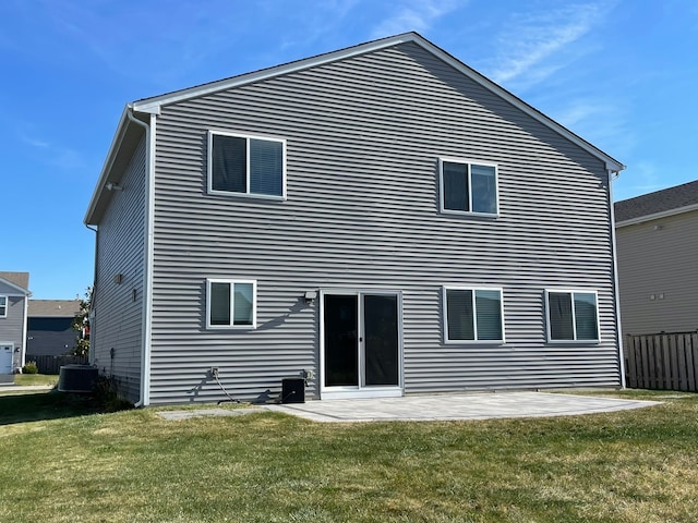 back of house with a patio area, a yard, and central AC unit