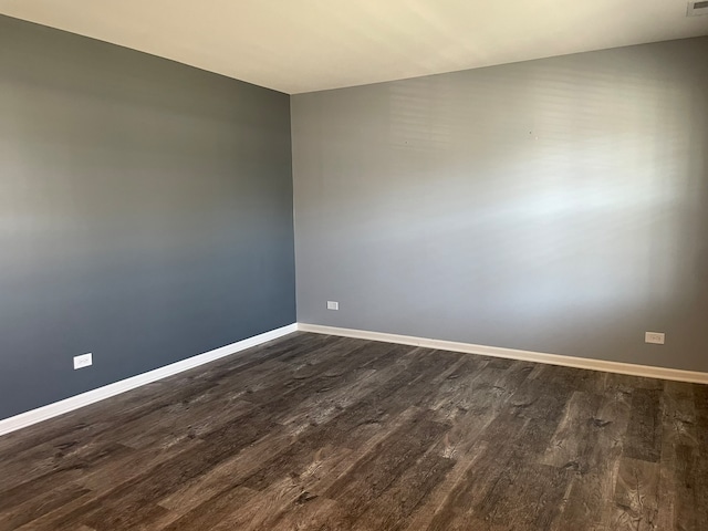 empty room featuring dark hardwood / wood-style floors