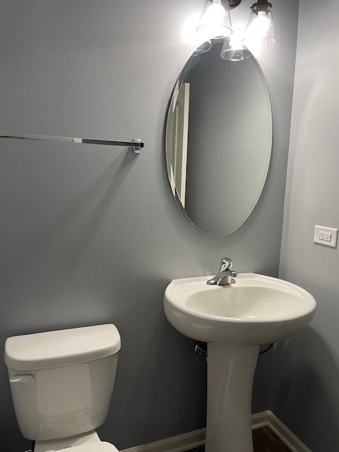 bathroom with toilet and sink