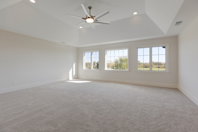 unfurnished room with lofted ceiling, light carpet, and ceiling fan