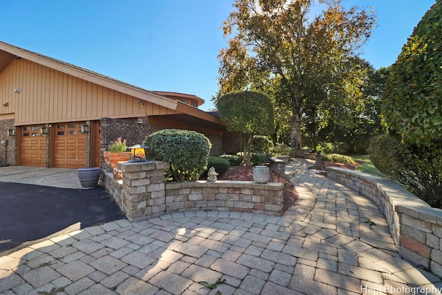 view of patio featuring a garage