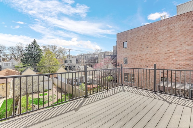 wooden terrace featuring a residential view