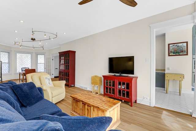 living area featuring a ceiling fan, crown molding, light wood-type flooring, baseboards, and recessed lighting