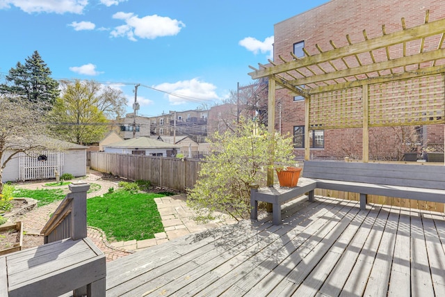 deck with fence, a pergola, an outdoor structure, and a residential view
