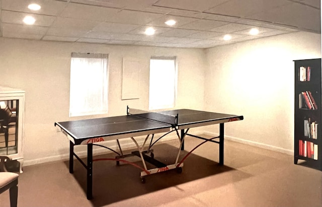 recreation room featuring a paneled ceiling