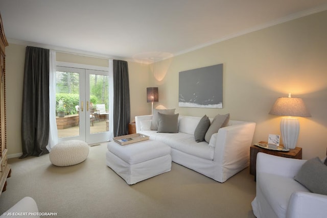 living room featuring french doors, carpet, and ornamental molding