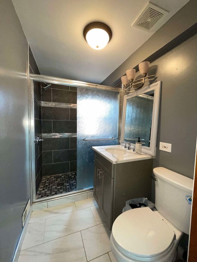 bathroom featuring vanity, toilet, and walk in shower