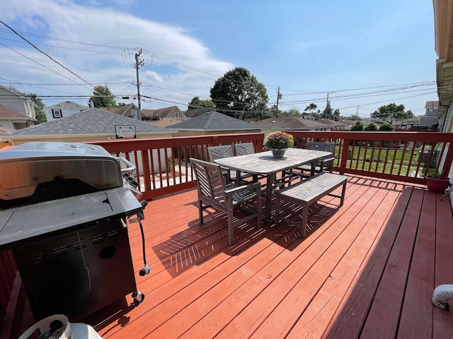 wooden terrace with area for grilling