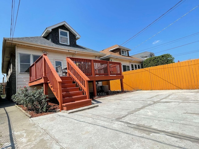 rear view of house with a deck