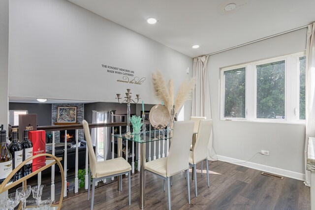 dining space with dark wood-type flooring