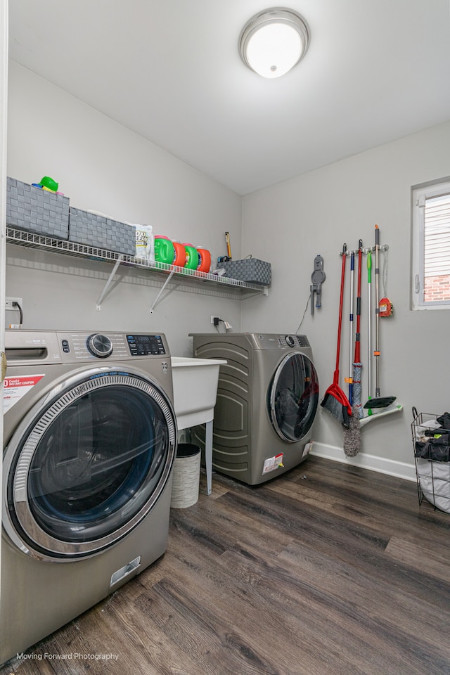 clothes washing area featuring dark hardwood / wood-style flooring