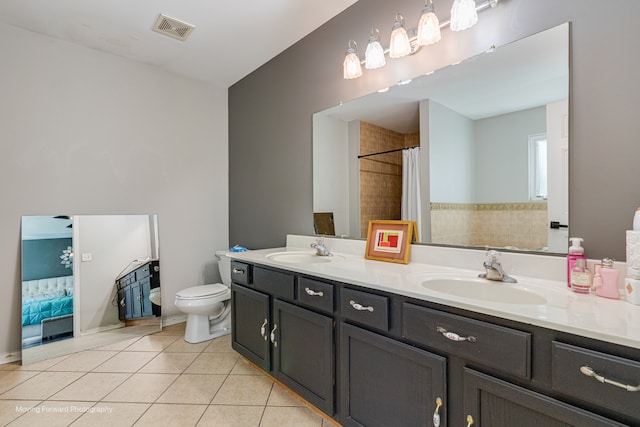 bathroom featuring tile patterned flooring, vanity, toilet, and a shower with shower curtain