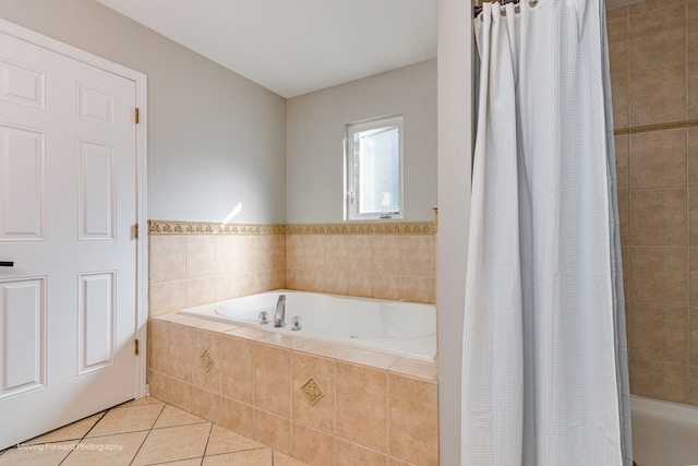 bathroom with tile patterned flooring and shower with separate bathtub