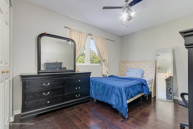 bedroom featuring ceiling fan and dark wood-type flooring