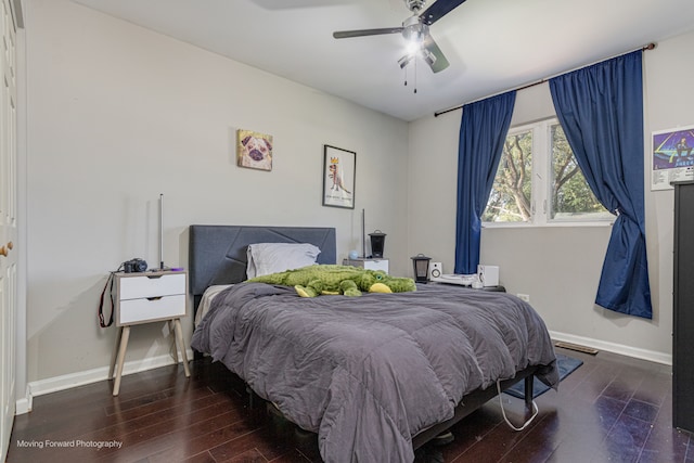 bedroom featuring ceiling fan and dark wood-type flooring