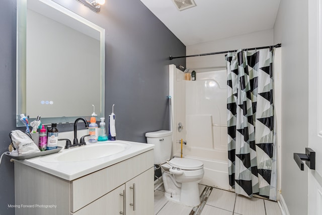 full bathroom with toilet, shower / bath combo, vanity, and tile patterned floors