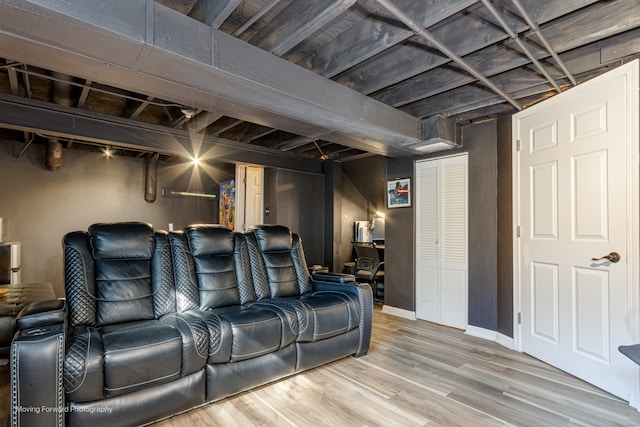 cinema room with hardwood / wood-style flooring