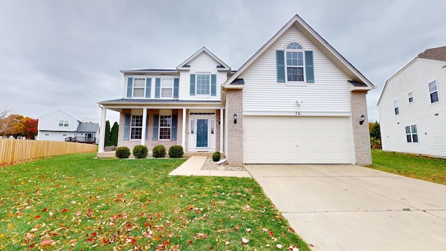 view of front property with a front yard, a porch, and a garage