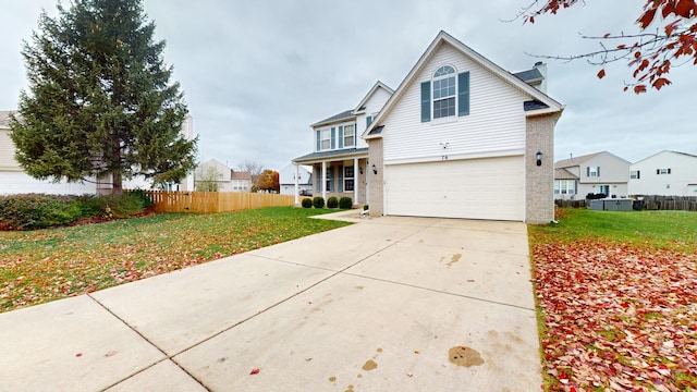 view of front of house featuring a front lawn and a garage