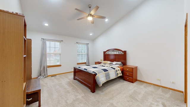 carpeted bedroom featuring ceiling fan and vaulted ceiling