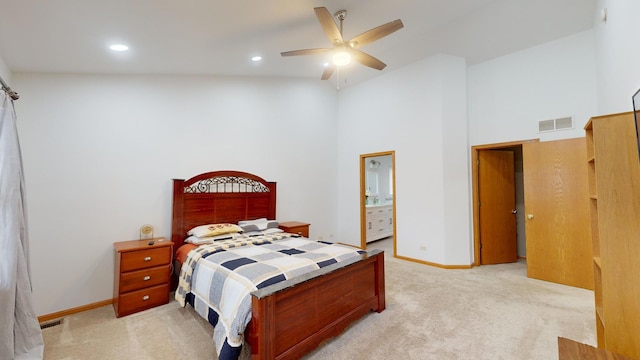 carpeted bedroom featuring high vaulted ceiling, ceiling fan, and connected bathroom