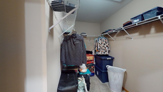 walk in closet featuring carpet